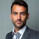 Professional headshot of Luiz Costa, a man with a confident and friendly expression.